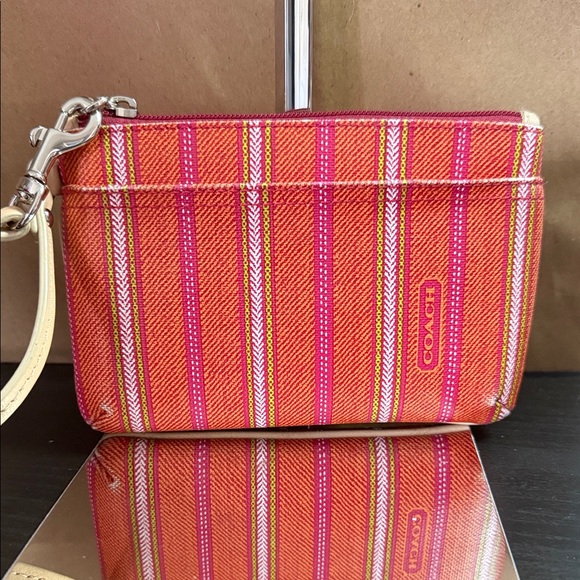 Coach Handbags - Coach Orange & Pink Striped Wristlet